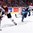 MONTREAL, CANADA - JANUARY 3: Latvia's Kristians Rubins #5 plays the puck while Finland's Teemu Vayrynen #27 defends during relegation round action at the 2017 IIHF World Junior Championship. (Photo by Andre Ringuette/HHOF-IIHF Images)

